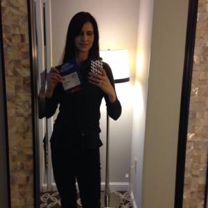 Even though you can't see it very well, that's me holding up my Agile 2014 badge that says "Board Member"