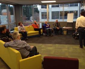 The Agile Alliance board gathering for the start of our meeting in Bellevue. From near to far, Declan Whelan, Samuel Crescencio, Pat Reed (slightly hidden), Linda Cook, Ola Ellnestam, Rebecca Parsons, Phil Brock (Managing Director, and our facilitator is the one standing. Missing from the photo are Shane Hastie, Juan Banda, and me.